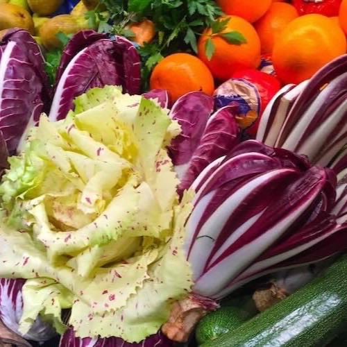 Radicchio, citrus and greens on a market stall in Naples
